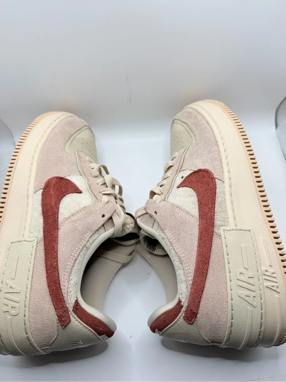 Nike Women's Low-Top Sneakers in Cream with Rust Swoosh